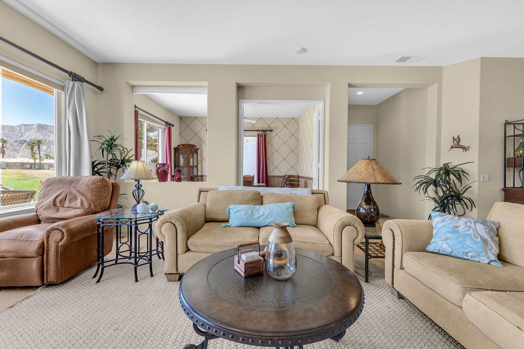 78079 Calle Norte La Quinta, CA 92253 - Photo 11 of 51 a living room with furniture and a large window