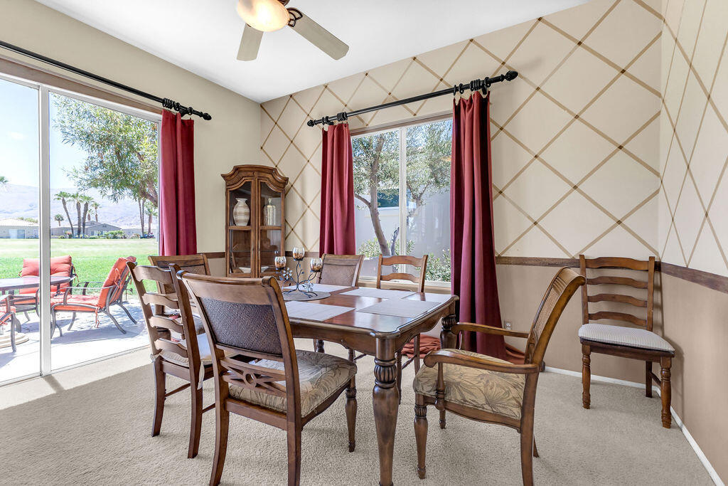 78079 Calle Norte La Quinta, CA 92253 - Photo 14 of 51 a view of a dining room with furniture window and outside view