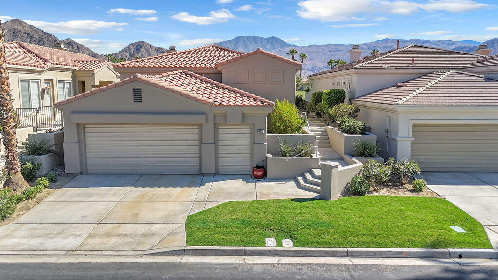 78079 Calle Norte La Quinta, CA 92253 - Photo 2 of 51 a front view of a house with a garden