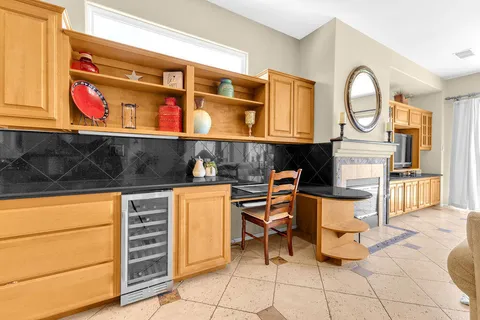 a stove top oven sitting inside of a kitchen