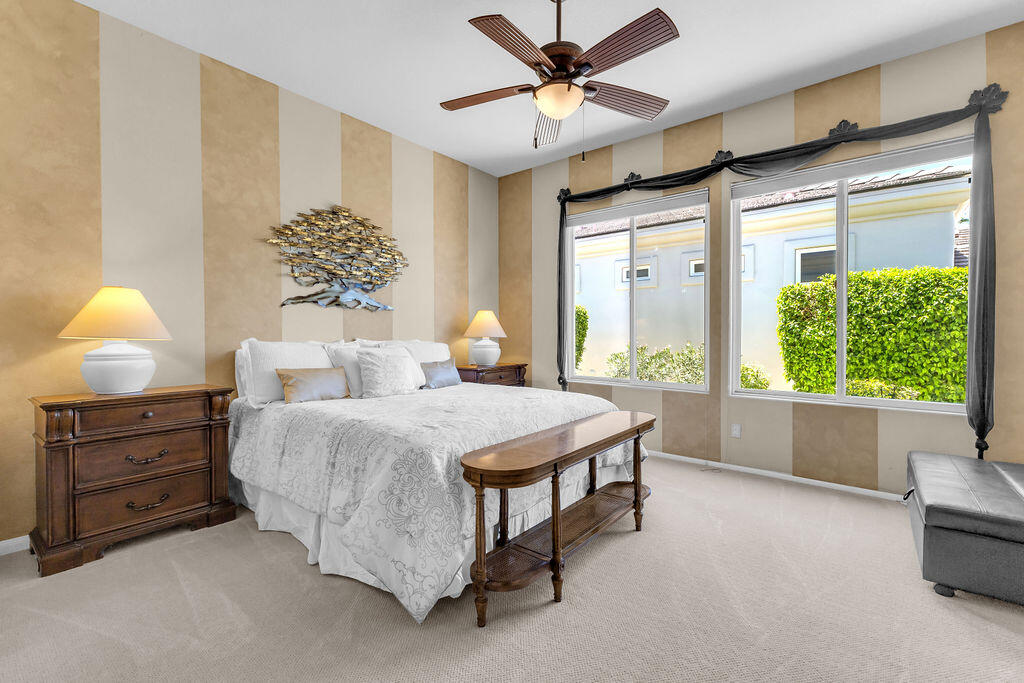 78079 Calle Norte La Quinta, CA 92253 - Photo 24 of 51 a bedroom with a bed and a chandelier