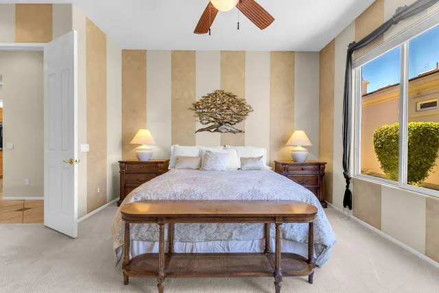 a bedroom with furniture and a window