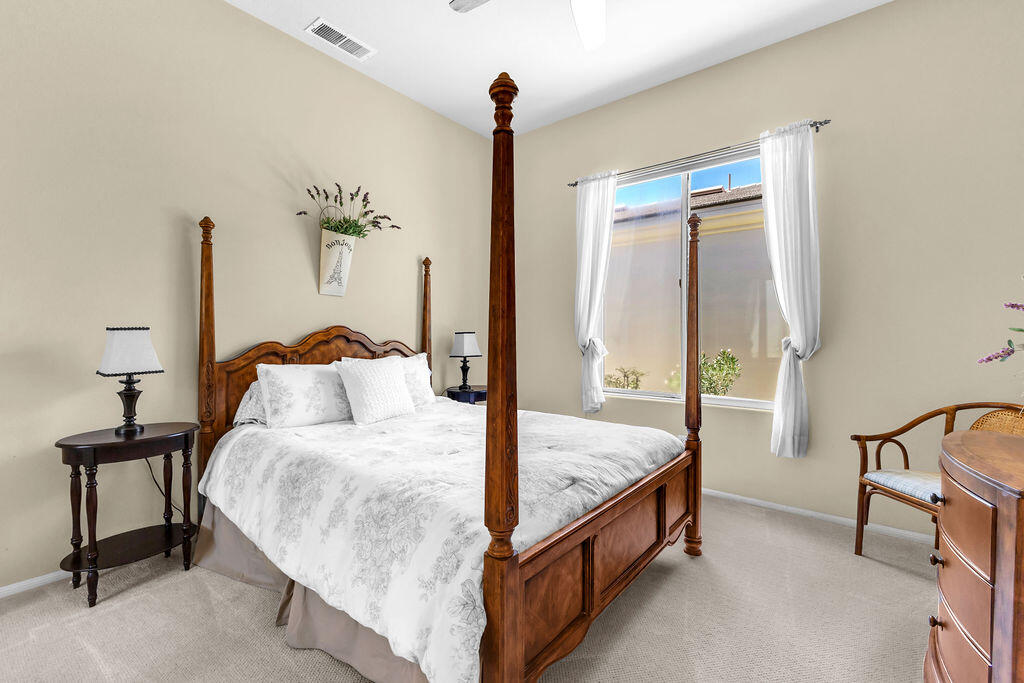 78079 Calle Norte La Quinta, CA 92253 - Photo 29 of 51 a bedroom with bed and a window