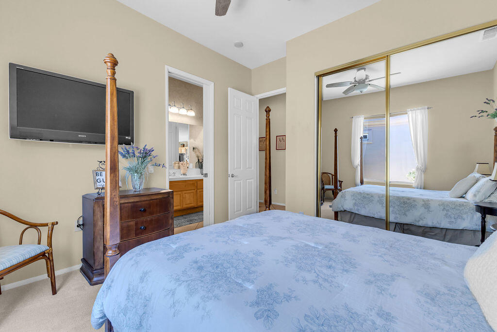 78079 Calle Norte La Quinta, CA 92253 - Photo 30 of 51 a spacious bedroom with a bed and a flat screen tv