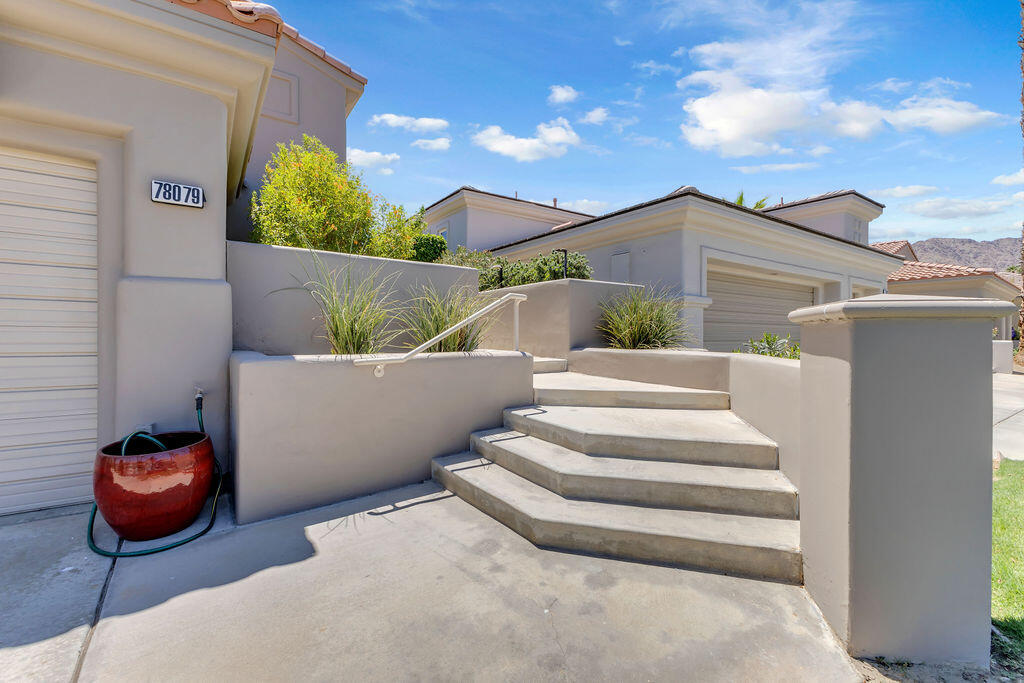78079 Calle Norte La Quinta, CA 92253 - Photo 3 of 51 a view of a chairs and table in backyard