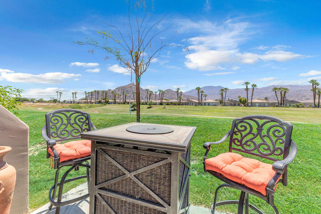 78079 Calle Norte La Quinta, CA 92253 - Photo 32 of 51 a view of a chairs and table in patio
