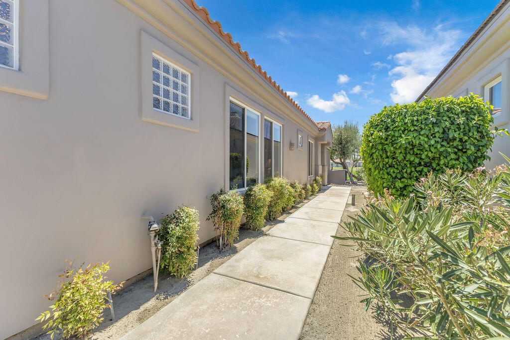 78079 Calle Norte La Quinta, CA 92253 - Photo 4 of 51 a entryway with flower pots