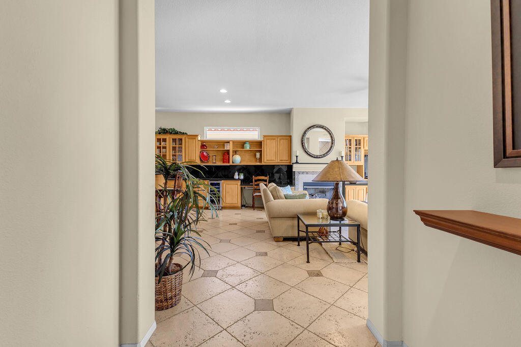 78079 Calle Norte La Quinta, CA 92253 - Photo 6 of 51 a living room with furniture and a painting on the wall