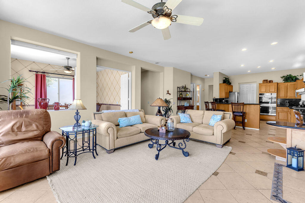 78079 Calle Norte La Quinta, CA 92253 - Photo 10 of 51 a living room with furniture kitchen view and a chandelier