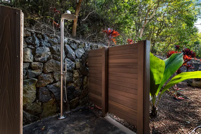 a view of a house with a flower garden