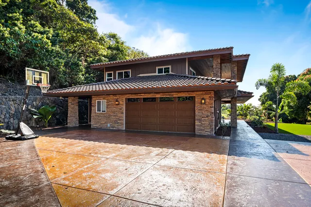 a front view of a house with a garage