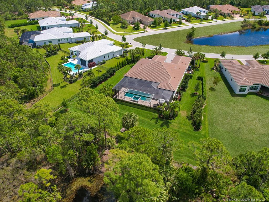 3246 Southwest Loriope Loop Palm City, FL 34990 - Photo 3 of 37 an aerial view of residential houses with outdoor space and street view