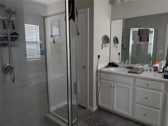 a bathroom with a granite countertop sink a mirror and a
