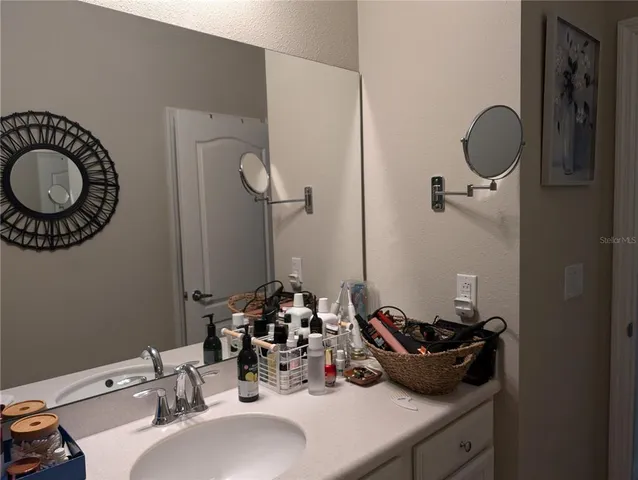 a bathroom with a sink and a mirror