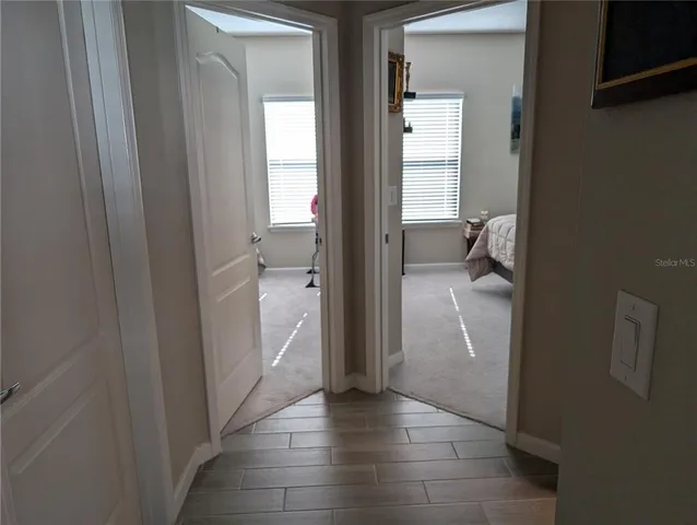 a view of a hallway with a room