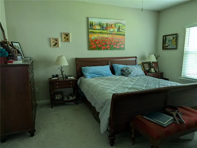 a bedroom with a bed and furniture