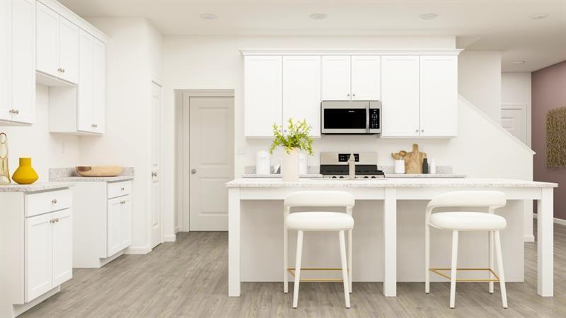 142 Vision Street Bethlehem, GA 30620 - Photo 5 of 21 a kitchen with white cabinets and chair