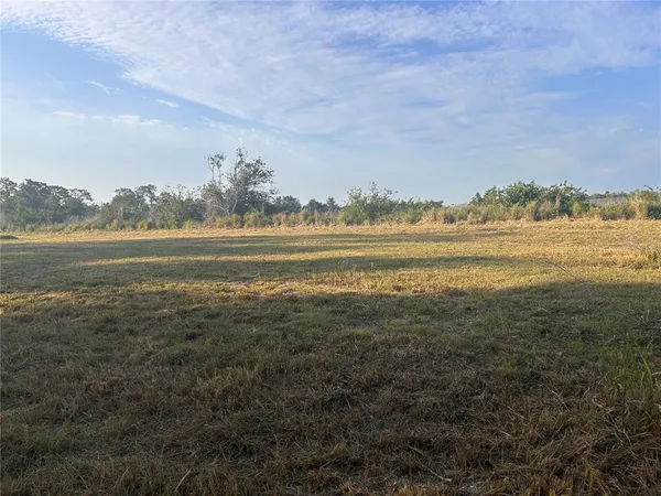 a view of an ocean with a mountain
