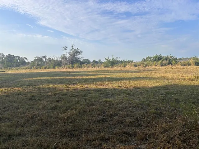 a view of an ocean with a mountain