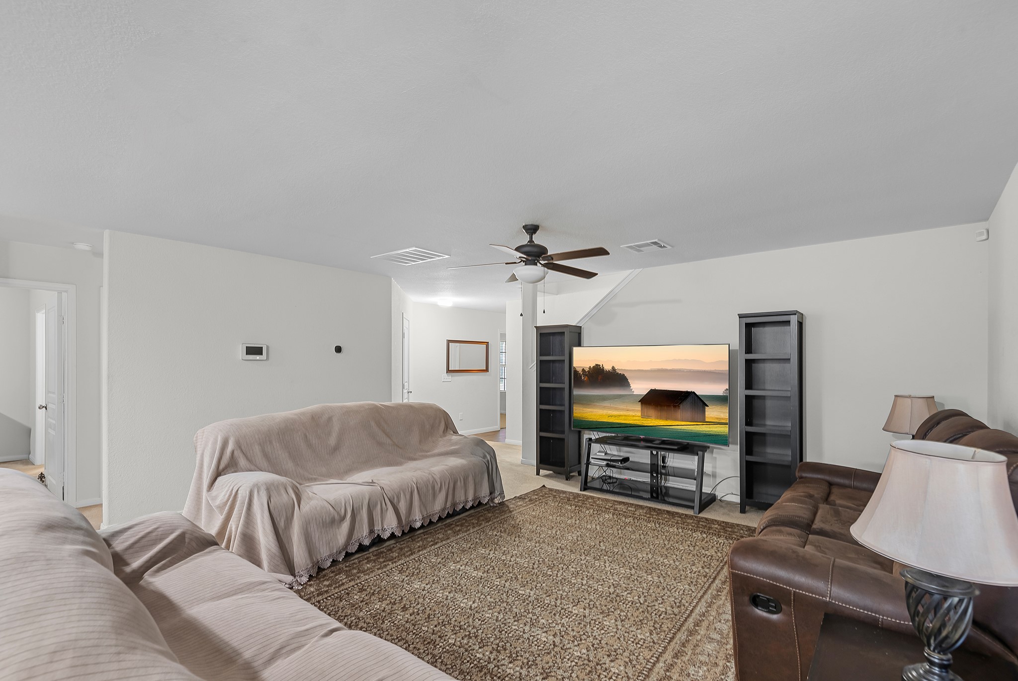 1614 Perennial Lane Rosenberg, TX 77471 - Photo 11 of 34 a bedroom with a bed and a flat screen tv