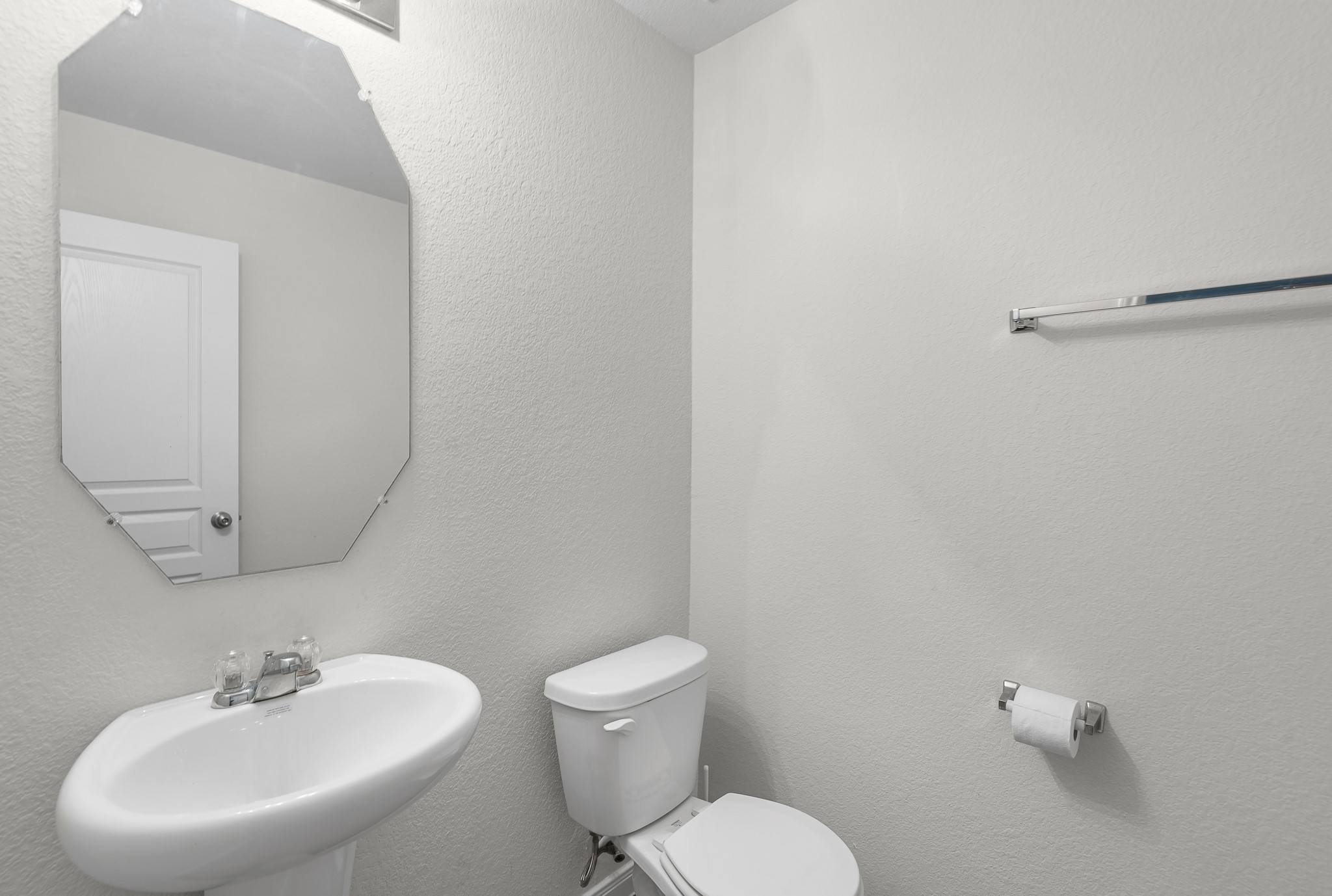 1614 Perennial Lane Rosenberg, TX 77471 - Photo 18 of 34 a bathroom with a toilet sink and mirror