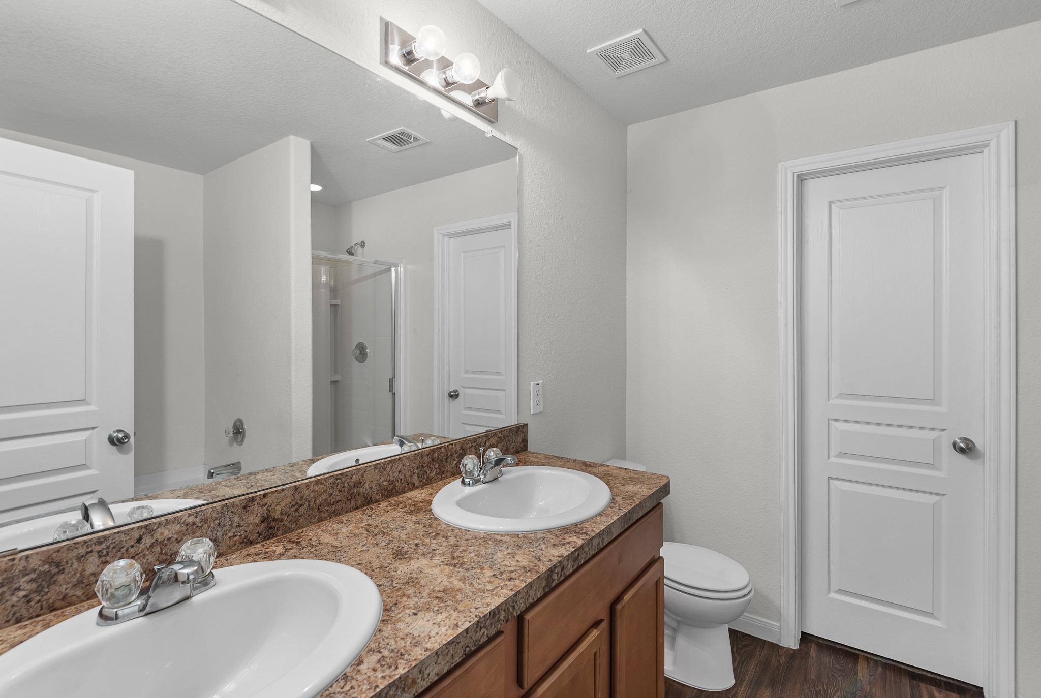 1614 Perennial Lane Rosenberg, TX 77471 - Photo 21 of 34 a bathroom with a granite countertop sink and a mirror