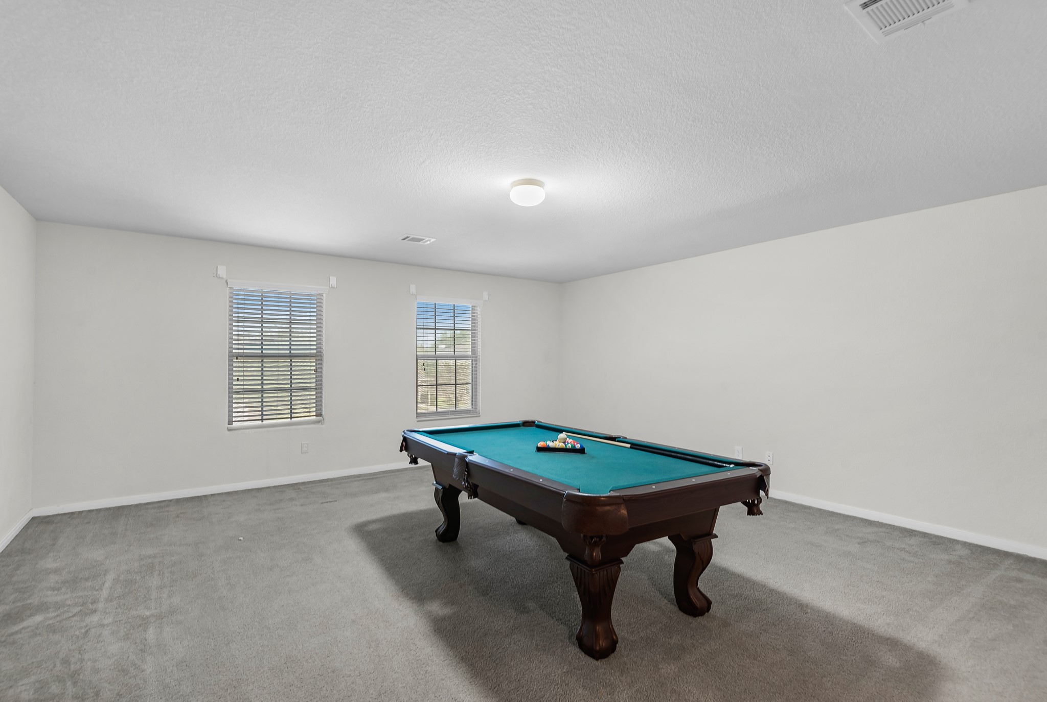 1614 Perennial Lane Rosenberg, TX 77471 - Photo 23 of 34 a room with pool table and windows