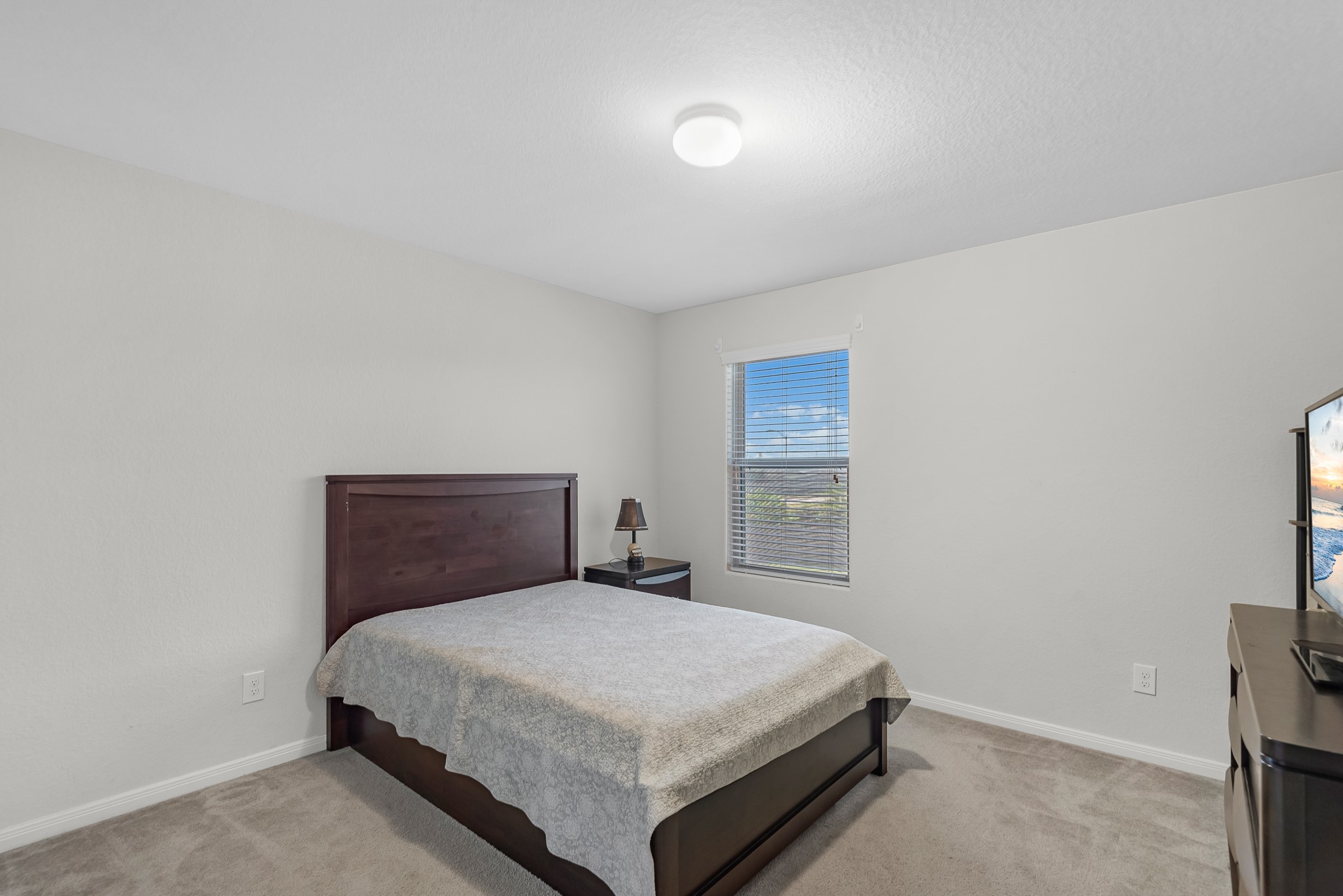1614 Perennial Lane Rosenberg, TX 77471 - Photo 26 of 34 a bedroom with a bed and window