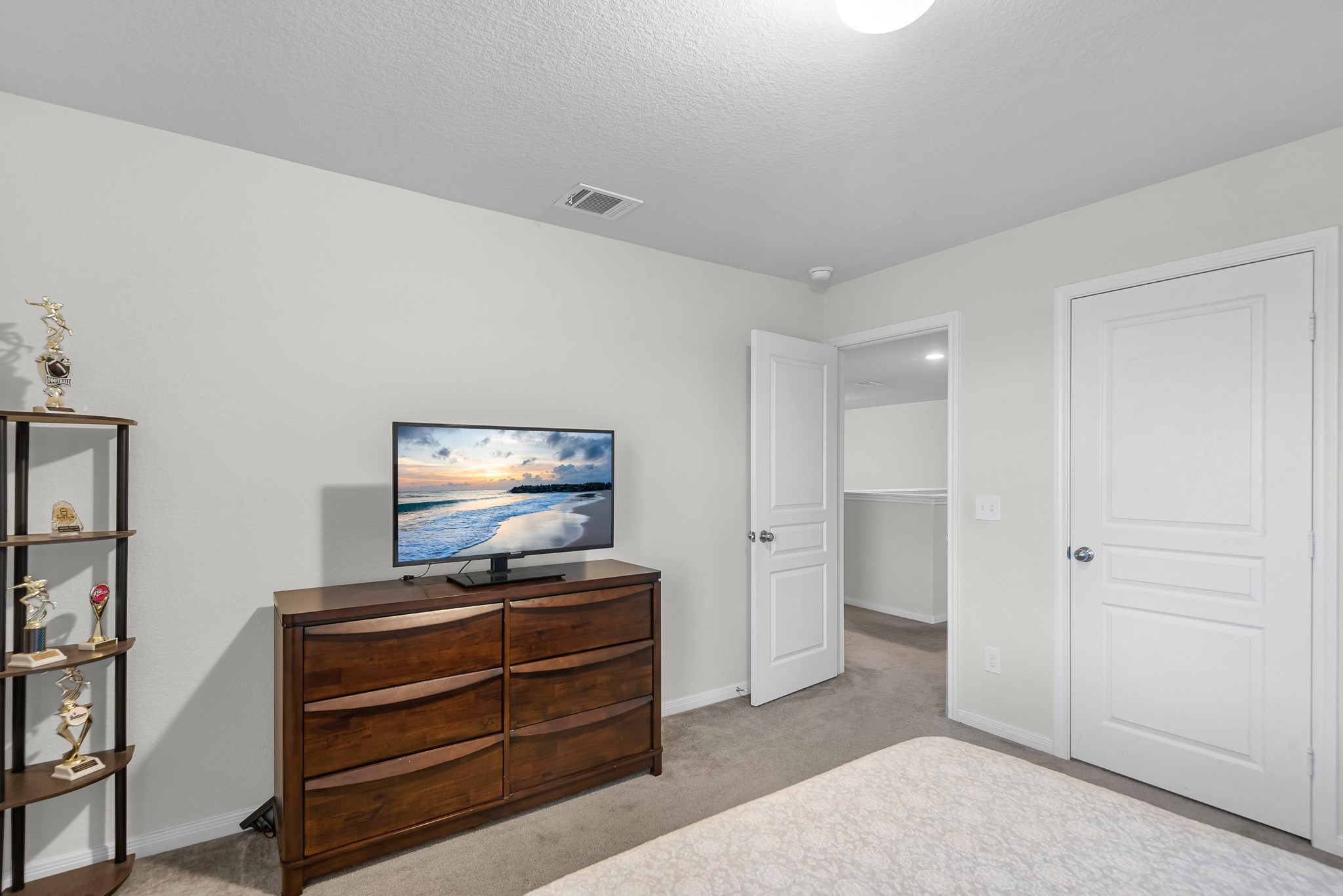 1614 Perennial Lane Rosenberg, TX 77471 - Photo 27 of 34 a living room with furniture and a flat screen tv