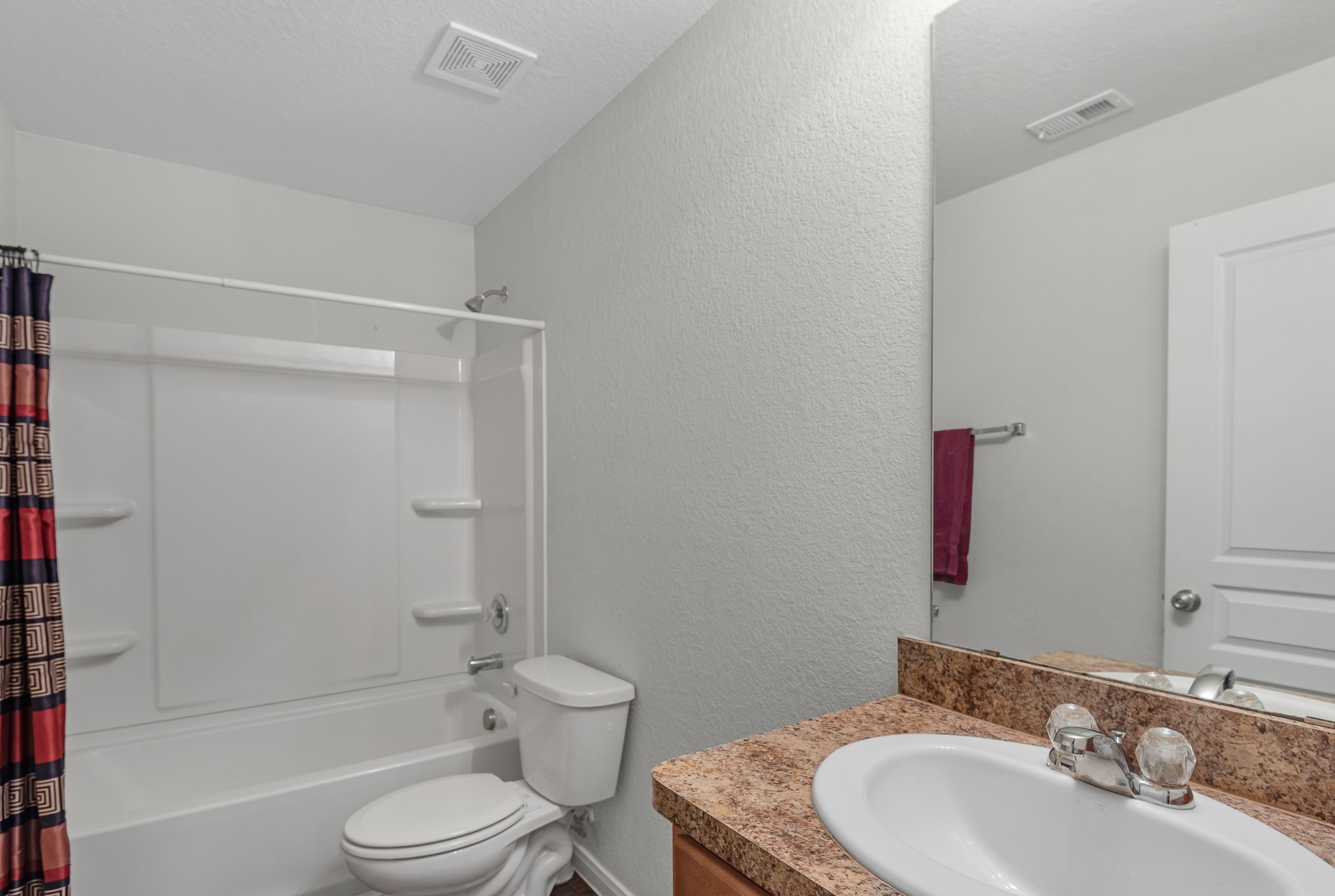 1614 Perennial Lane Rosenberg, TX 77471 - Photo 31 of 34 a bathroom with a granite countertop toilet sink and shower