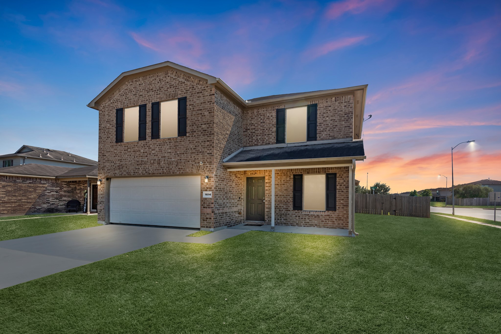 1614 Perennial Lane Rosenberg, TX 77471 - Photo 34 of 34 a front view of a house with a garden and yard