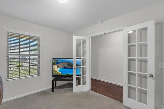 a bedroom with furniture and a window