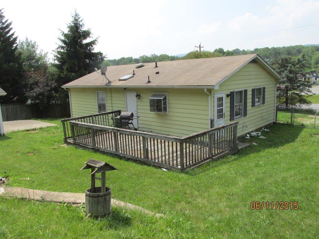 5290 Blue Ridge Boulevard Blue Ridge, VA 24064 - Photo 3 of 4 a view of a house with a yard and deck