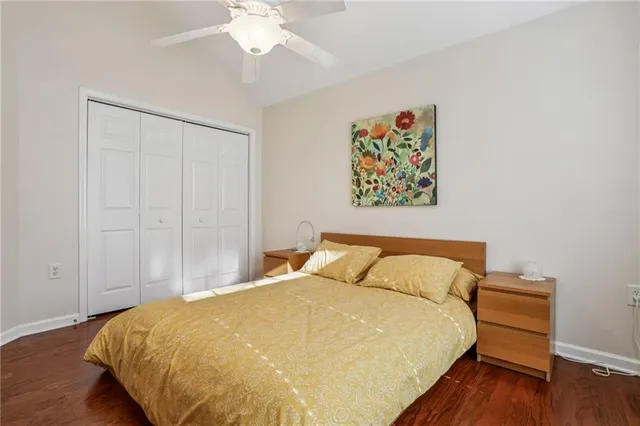 a bedroom with a bed and a mirror