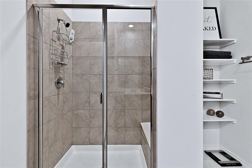717 Rawhide Way Princeton, TX 75407 - Photo 12 of 31 a bathroom with a shower