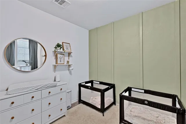 a bedroom with furniture and window