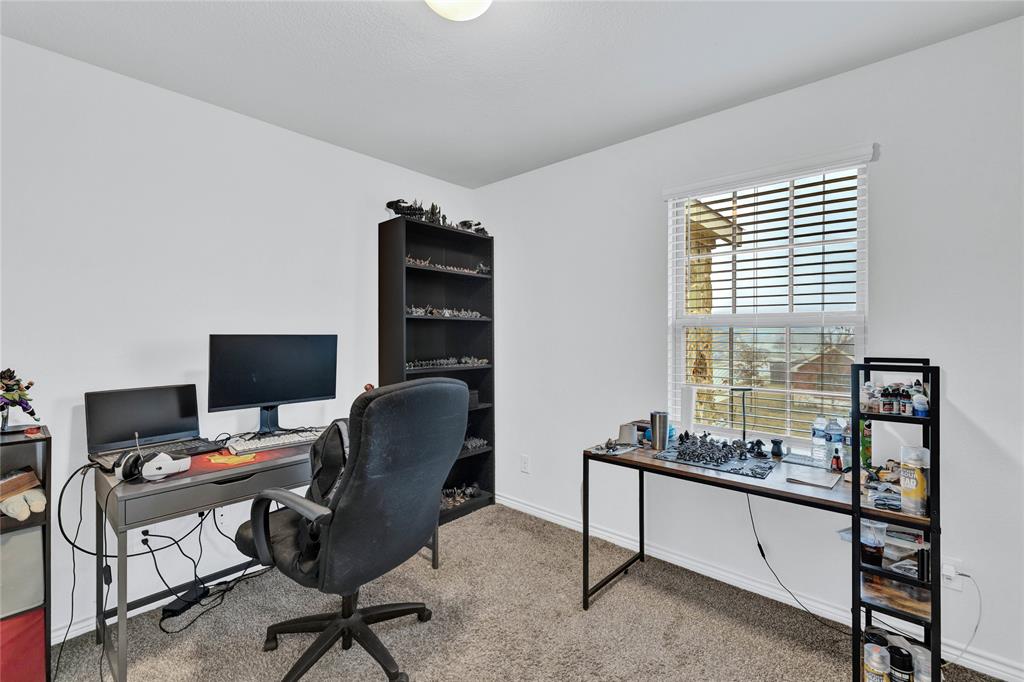 717 Rawhide Way Princeton, TX 75407 - Photo 17 of 31 a livingroom with workspace and a window