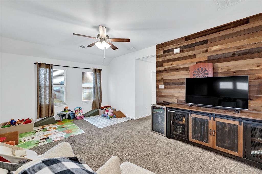 717 Rawhide Way Princeton, TX 75407 - Photo 19 of 31 a living room with furniture and flat screen tv