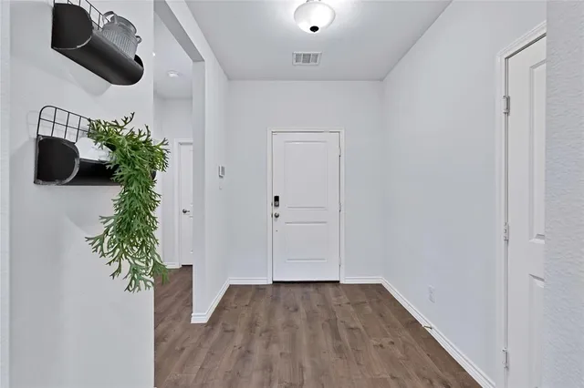 a view of entryway with wooden floor