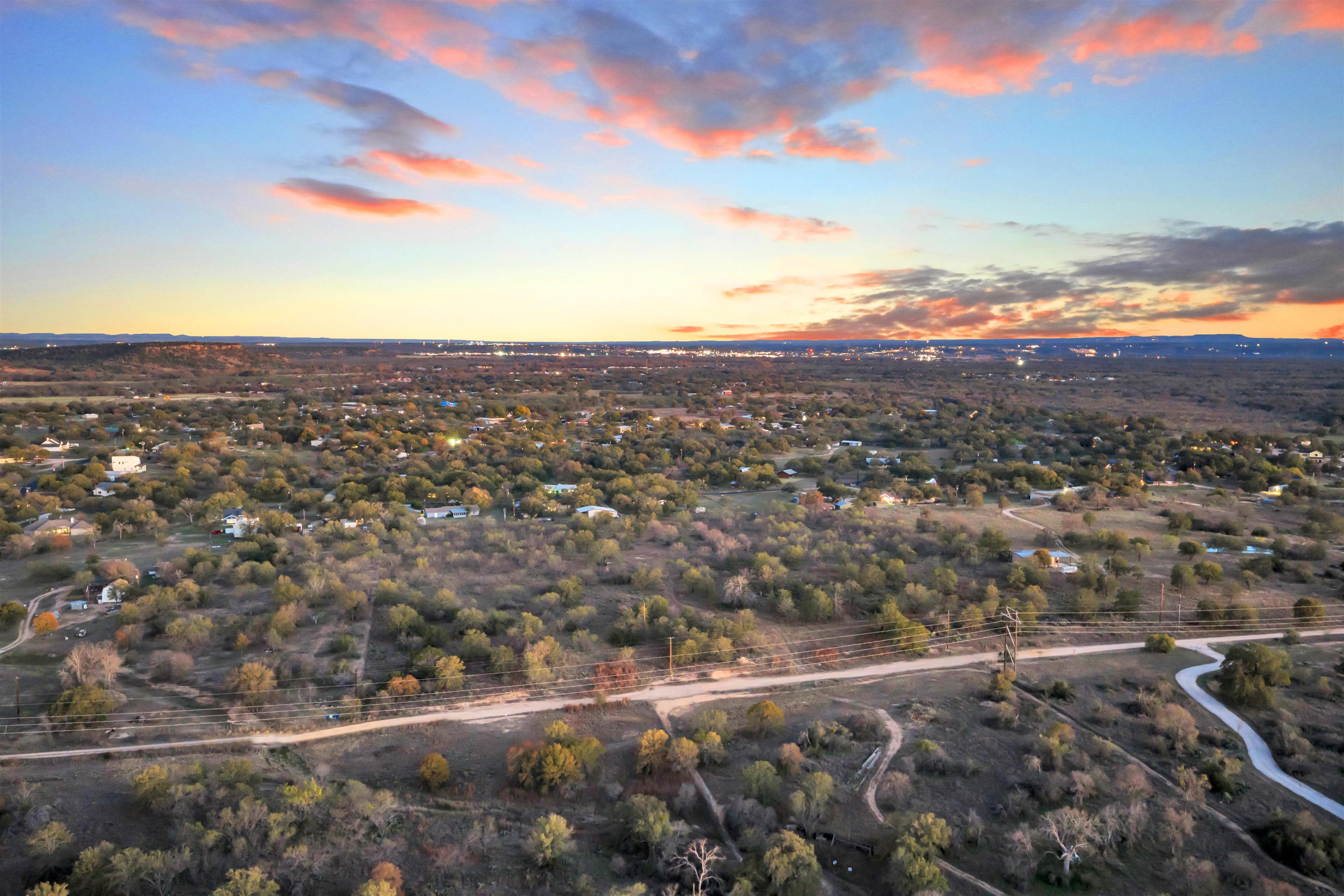 111 Quail Trail Marble Falls, TX 78654 - Photo 19 of 25 a view of a city with sunset