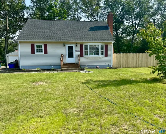 a house that has a big yard in front of it