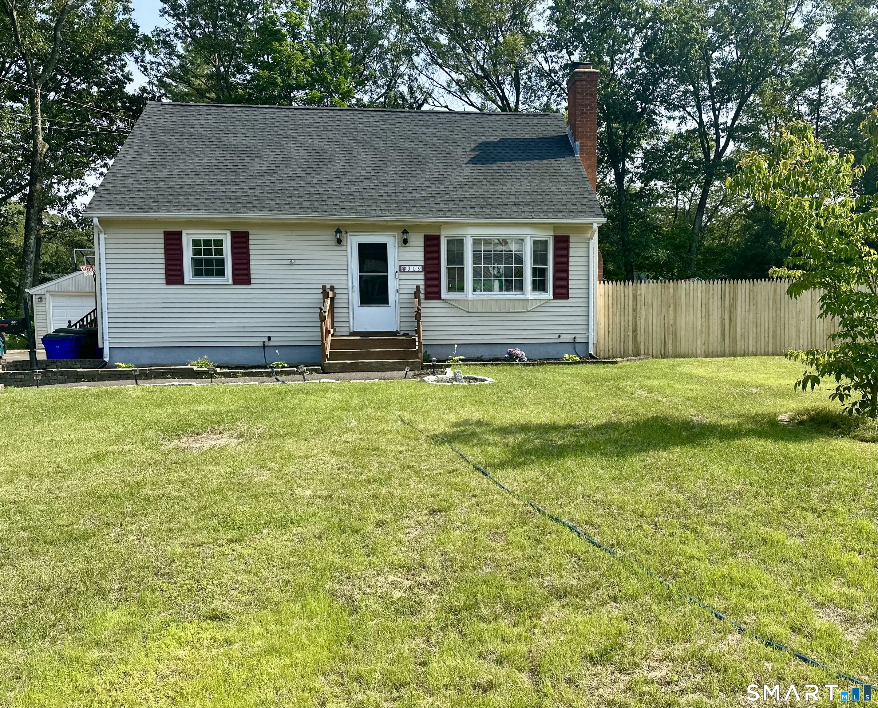 a house that has a big yard in front of it