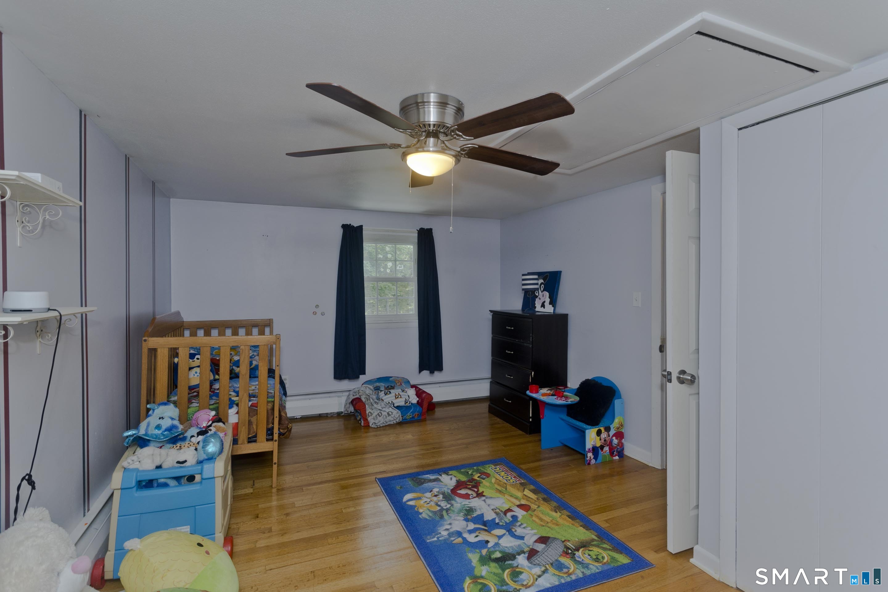 309 South Elm Street Windsor Locks, CT 06096 - Photo 20 of 38 a bed room with furniture and wooden floor