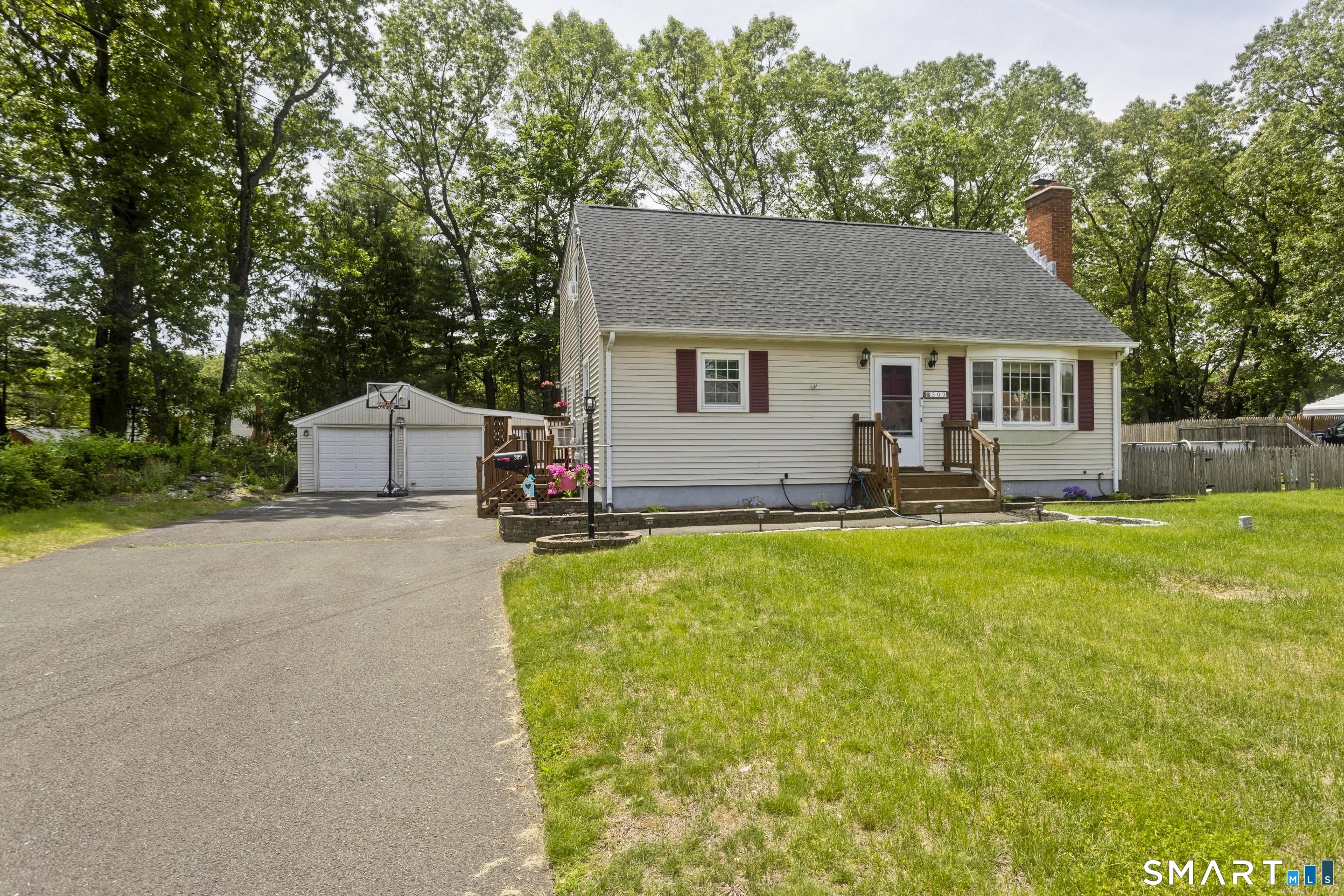 309 South Elm Street Windsor Locks, CT 06096 - Photo 2 of 38 a front view of house with yard and green space