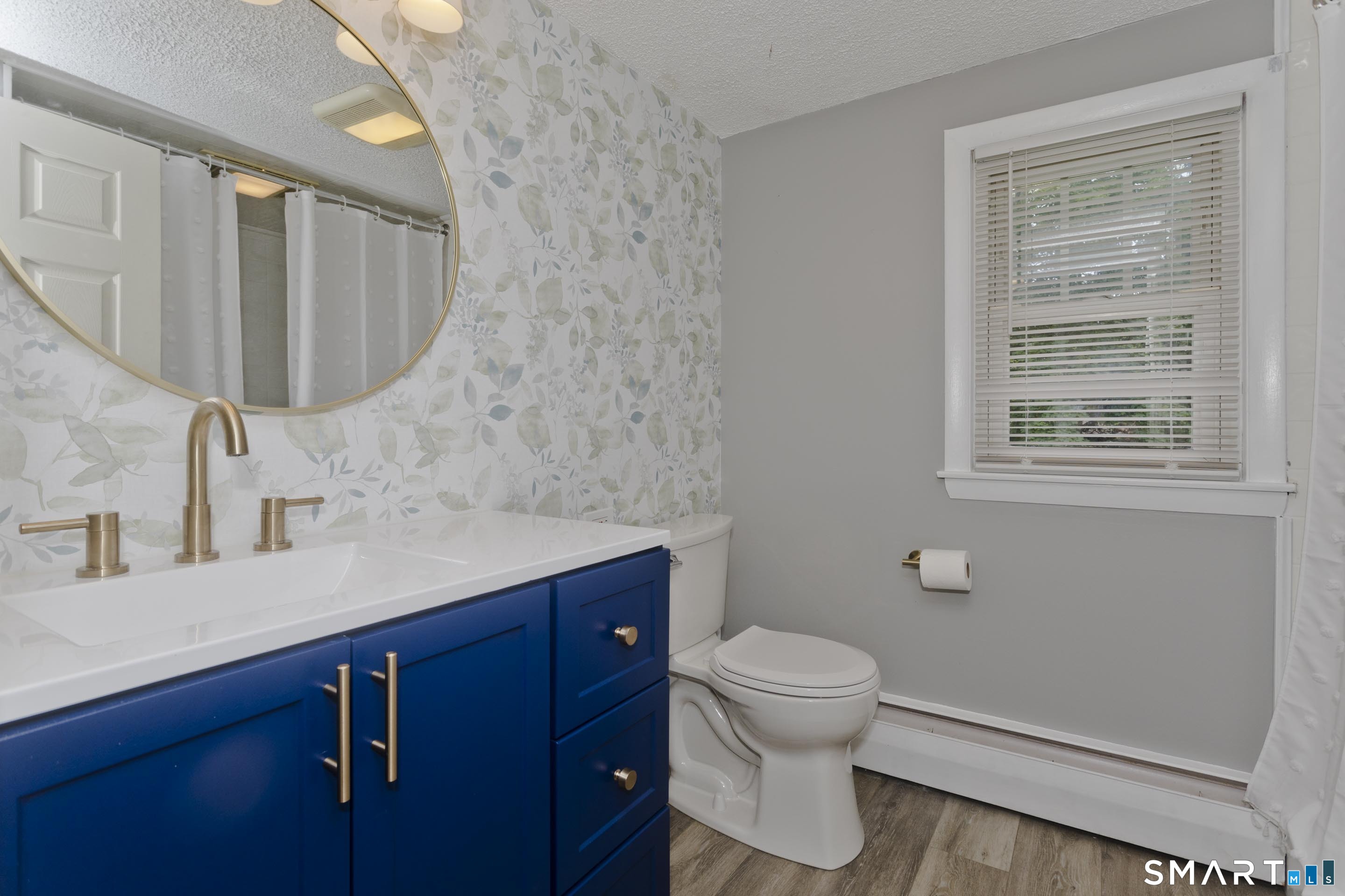 309 South Elm Street Windsor Locks, CT 06096 - Photo 23 of 38 a bathroom with a sink a toilet and shower