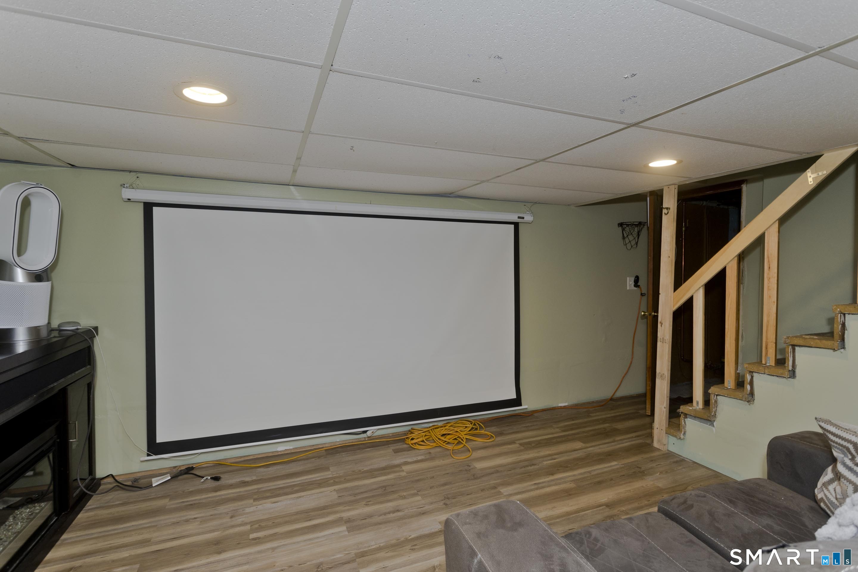 309 South Elm Street Windsor Locks, CT 06096 - Photo 26 of 38 a view of an empty room with wooden floor and staircase