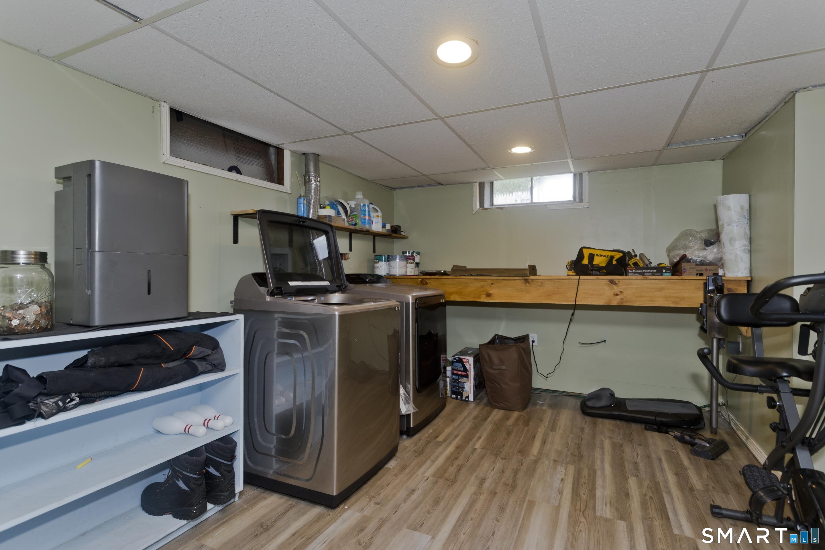 309 South Elm Street Windsor Locks, CT 06096 - Photo 28 of 38 a kitchen with stainless steel appliances granite countertop a stove a sink dishwasher and a refrigerator with wooden floor