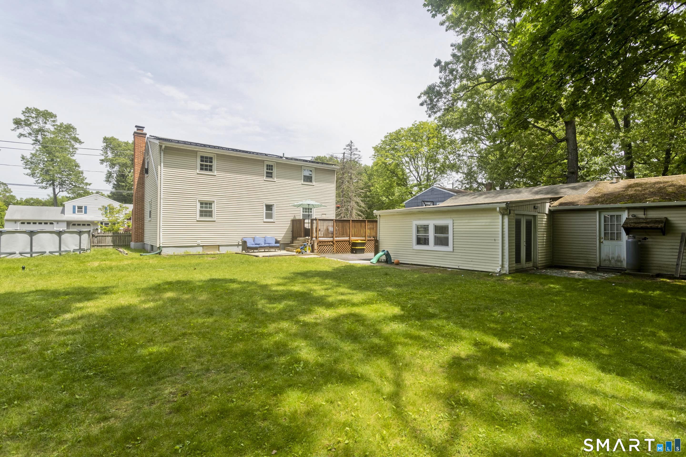 309 South Elm Street Windsor Locks, CT 06096 - Photo 36 of 38 a view of a backyard with plants and large trees