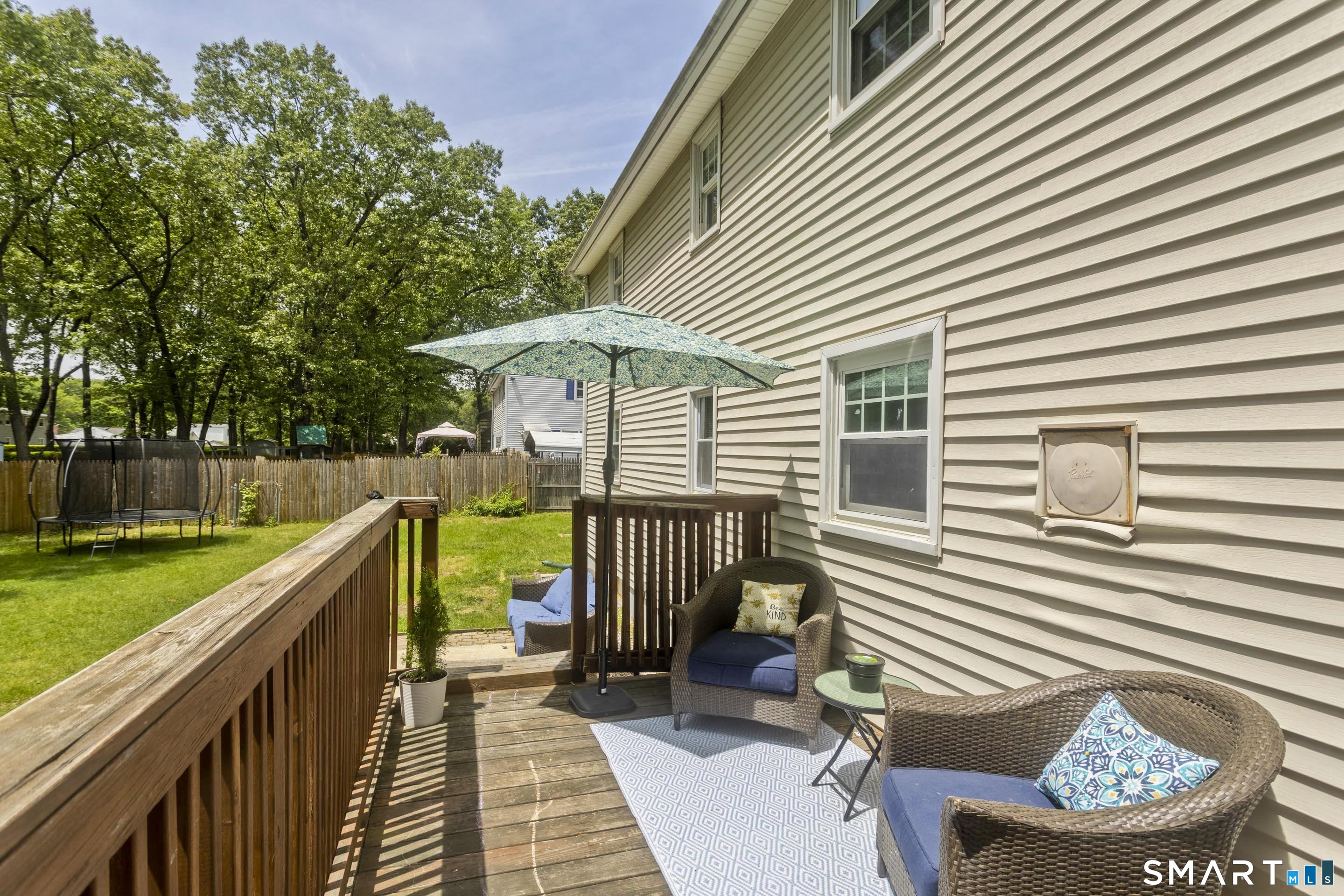 309 South Elm Street Windsor Locks, CT 06096 - Photo 38 of 38 a view of a patio with a table and chairs under an umbrella