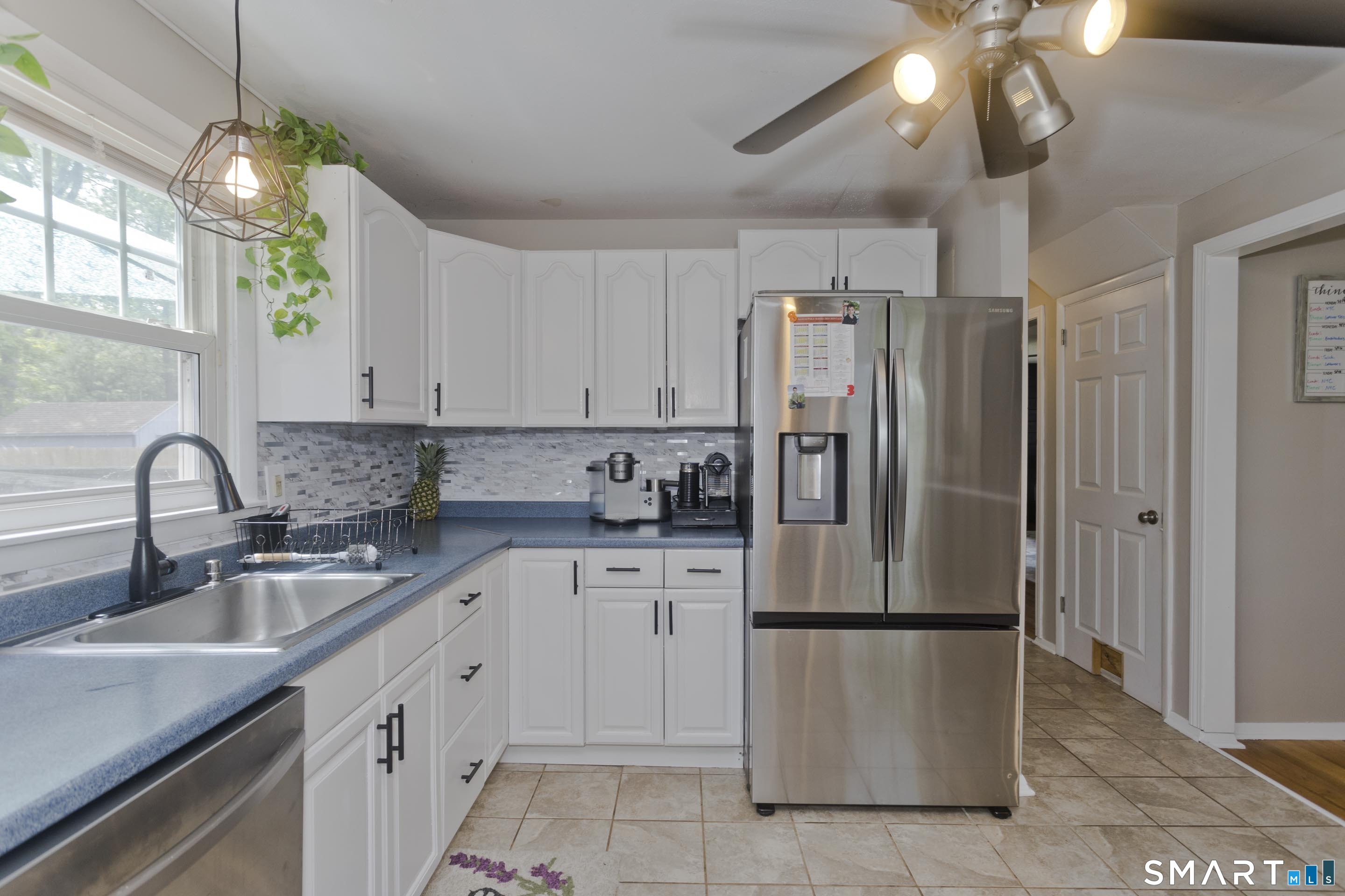 309 South Elm Street Windsor Locks, CT 06096 - Photo 5 of 38 a kitchen with appliances a sink and cabinets